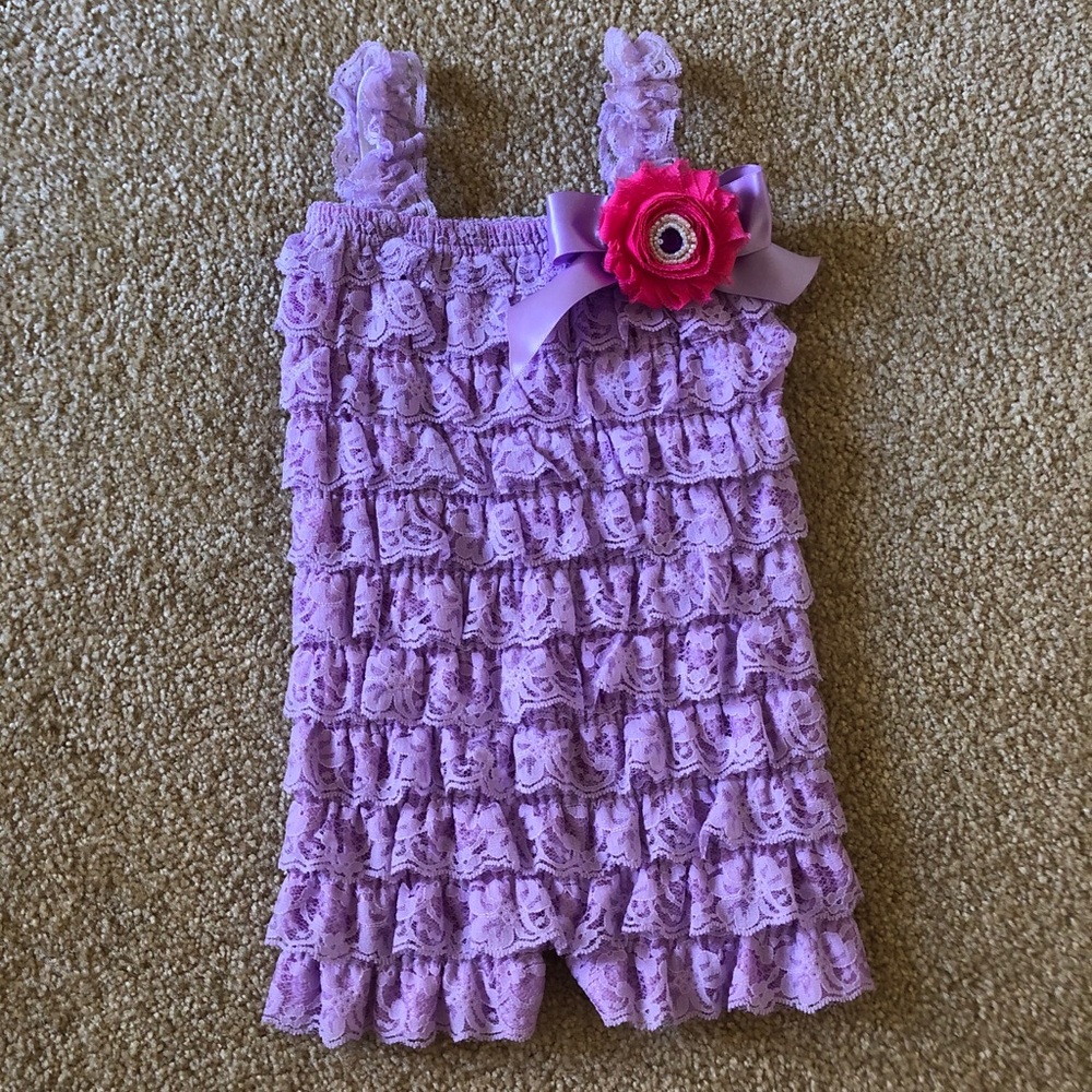 Purple lace romper for little girls.